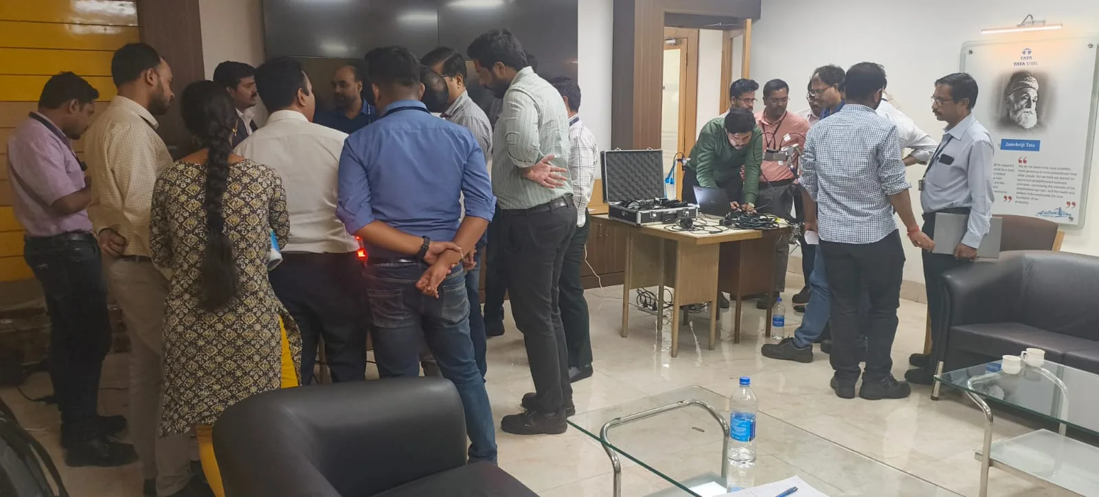 Group attending a technical equipment demonstration